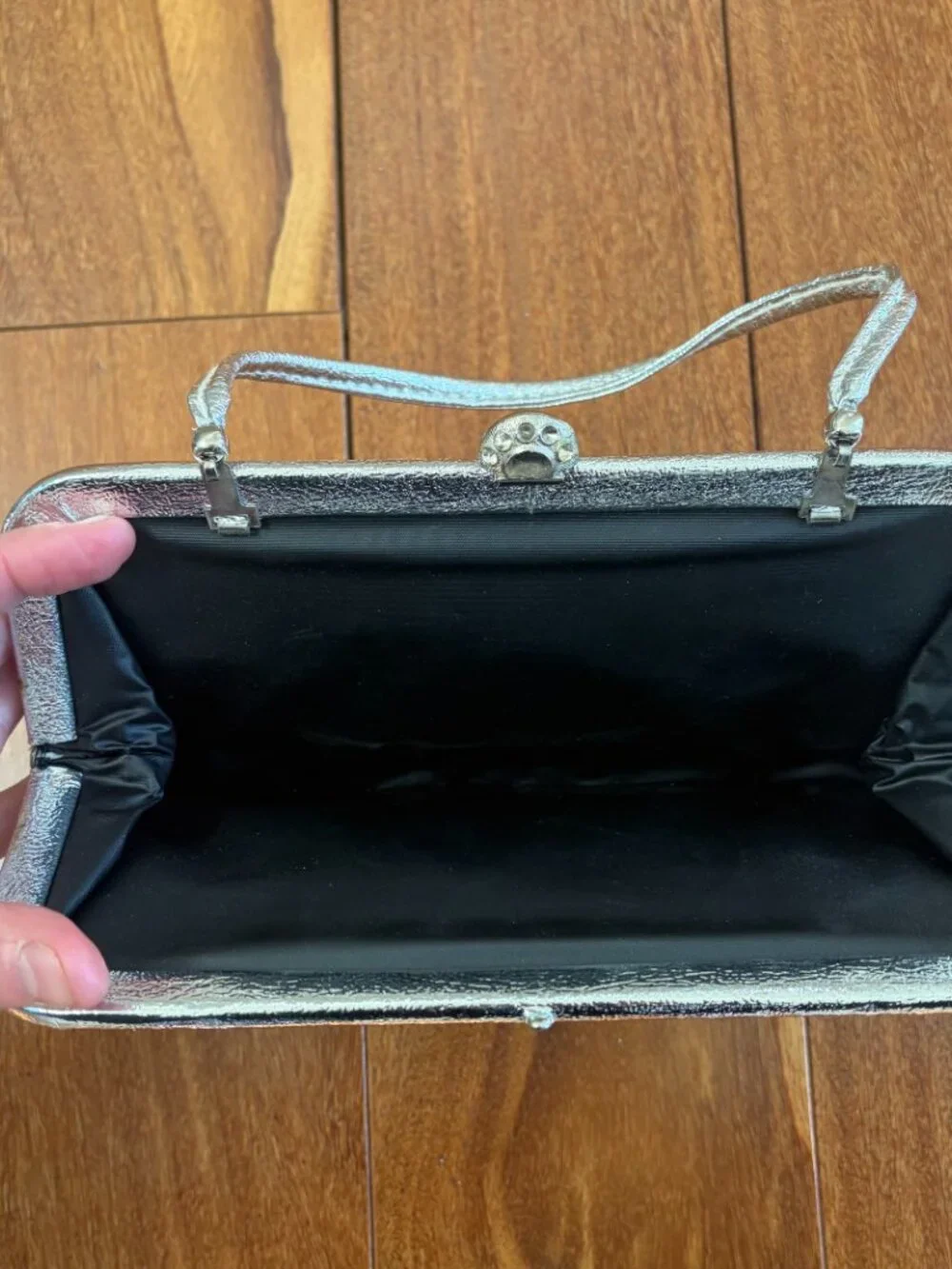 Silver vintage metallic evening clutch with a kiss lock closure and thin strap